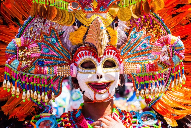 stock-photo-smile-philippines-mardi-gras-colors-headdress-mask-festival-mardigras-street-dance-9c32a56b-ee10-4735-a231-ff46197080ac